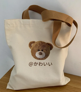 Our adorable street-style Japanese Kanji Cute Teddy Tote Bag is a versatile design that combines youthful style with practical functionality, making it a perfect companion for everyday use. kawaii